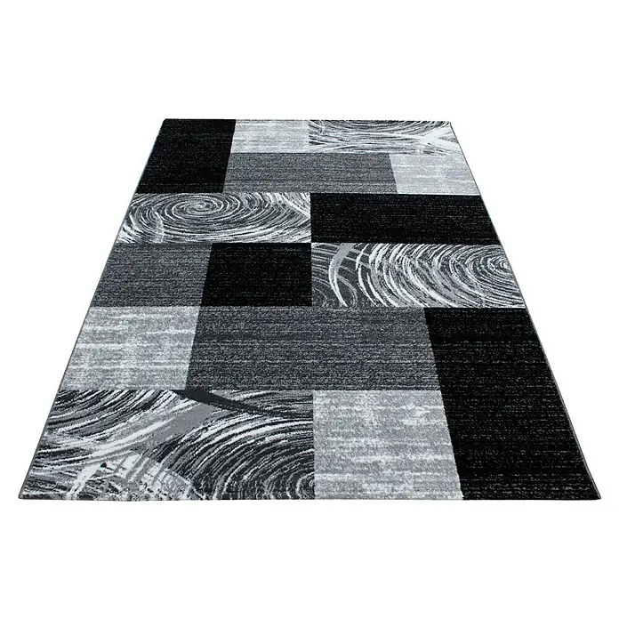 Kurzflorteppich Parma 9220 - Schwarz, 200 x 140 cm, 100 % Polypropylen - Ein rechteckiger Teppich mit einem modernen Muster aus schwarzen, grauen und weißen Blöcken, ideal für ein stilvolles Zuhause.