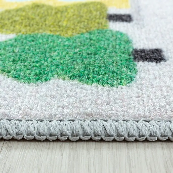 Kinderteppich Play 2902 - Grau, 230 x 160 cm, 100% Polyamide - Detailaufnahme eines Teppichs mit bunten, abstrakten Mustern und sauberer, grauer Umrandung.