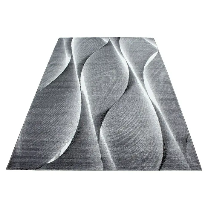 Kurzflorteppich Parma 9310Schwarz, 170 x 120 cm, 100% Polypropylen - Dieser Teppich hat ein modernes Design mit abstrakten, wellenförmigen Mustern in Grau- und Weißtönen, ideal für jeden Raum.