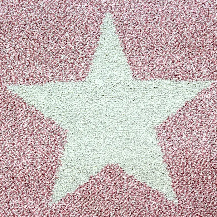 Kinderteppich Kids 0620Pink, 150 x 80 cm, 100% Polypropylen - Nahaufnahme eines rosa Teppichs mit großem weißen Stern in der Mitte, der eine gemütliche und verspielte Atmosphäre schafft.