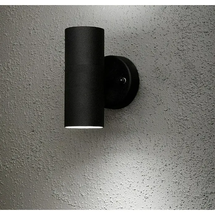 Konstsmide Außenwandleuchte - 35 W, 16 x 11,5 x 11 cm, Anthrazit, IP44 - Die moderne, schwarze Wandleuchte mit zylindrischem Design strahlt warmes Licht aus und betont die Struktur der Wand. Stilvolle Beleuchtung.
