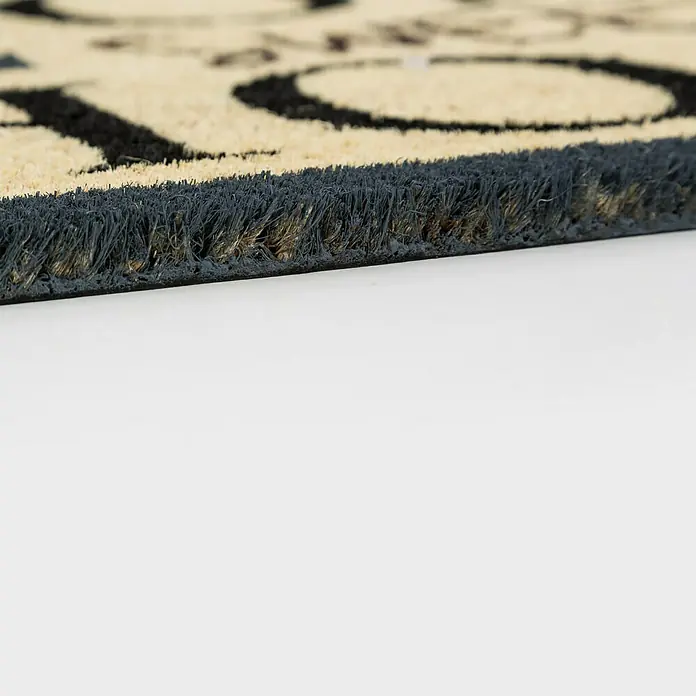 Astra Coco Fußmatte Style - 40 x 60 cm, Bunt, Material Nutzschicht: 100 % Kokos, Schriftzüge, Kokos - Detailaufnahme einer Fußmatte mit Textur und dunklem Rand. Ideal für Sauberkeit und Stil im Eingangsbereich.