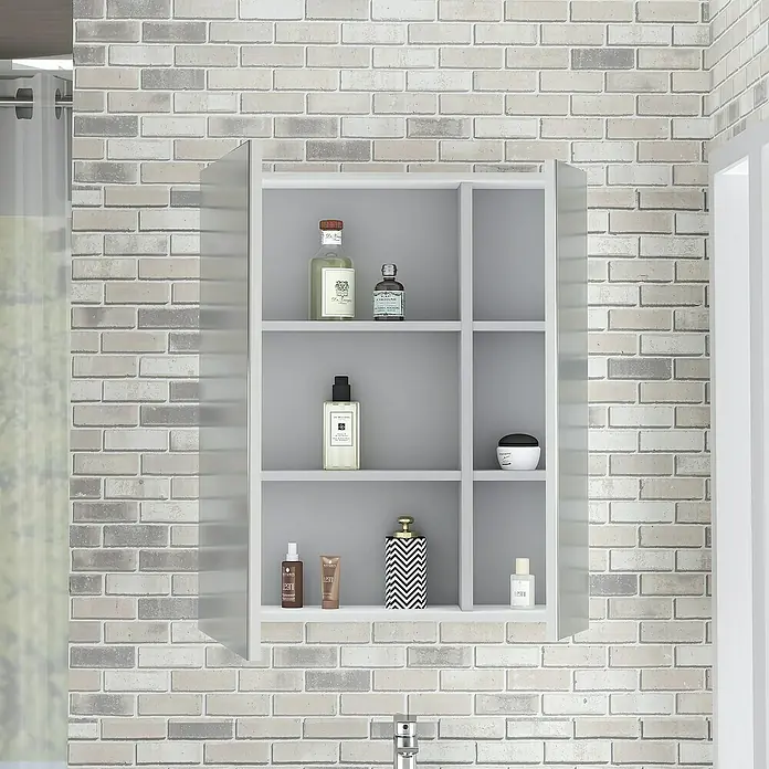 Artysan Armario con espejo - An x Al: 70 x 80 cm, Plástico, Blanco - Un armario de baño con diversos productos para el cuidado frente a una pared de ladrillo. El estante está lleno de lociones y perfumes.