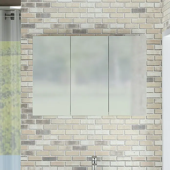 Artysan Armario con espejo - An x Al: 90 x 65 cm, Plástico, Blanco - Un armario con espejo de tres puertas está montado en una pared de ladrillos sobre un lavabo, que ofrece un elegante espacio de almacenamiento en el baño.