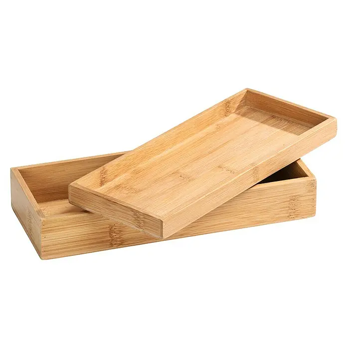 Wenko Aufbewahrungsbox Terra - 10 x 24 x 5,5 cm, Bambus - Das Bild zeigt eine rechteckige Bambusbox mit einem abnehmbaren Deckel, ideal für Aufbewahrung und Organisation.
