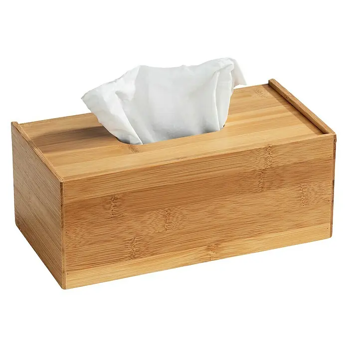Wenko Kosmetiktuchbox Terra - 10 x 25 x 13 cm, Bambus - Diese Aufnahme zeigt eine rechteckige Taschentuchbox aus Bambusholz mit einem Taschentuch, das aus der Öffnung oben herausragt.