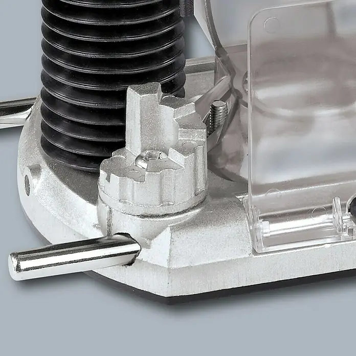 Einhell Elektro-Oberfräse TC-RO 1155 E - 1.100 W, 11.000 U/min - 30.000 U/min - Nahaufnahme einer Oberfräse, die Details der Mechanik und Bauweise hervorhebt. Das Werkzeug ist robust und präzise gefertigt.