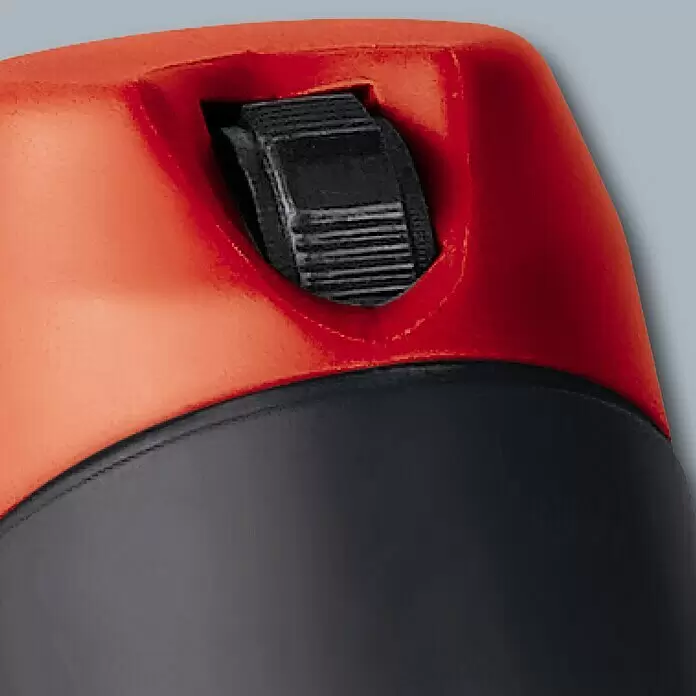 Einhell Fresadora eléctrica TC-RO 1155 E - 1.100 W, 11.000 r.p.m. - 30.000 r.p.m., Diámetro del portaherramientas: 6 mm - 8 mm - Interruptor negro estriado en la carcasa naranja de una herramienta eléctrica.