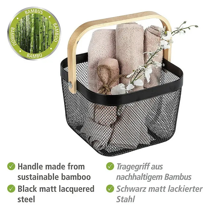 Wenko Bambusa Bad-Aufbewahrungskorb25 x 25 x 17 cm, Stahl, Schwarz/Bambus - Ein stilvoller, schwarzer Metallkorb mit Bambusgriff, gefüllt mit hellen Handtüchern und dekorativen Blumen.