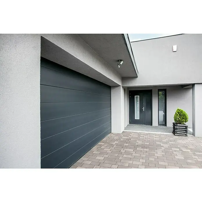 EHL Pflasterstein Corte - Grau/Anthrazit, Gesamtstückzahl: 36 Stk., Rechteckig - Modernes Haus mit grauer Garage. Das Garagentor ist geschlossen und fügt sich nahtlos in das zeitgemäße Design des Hauses ein.