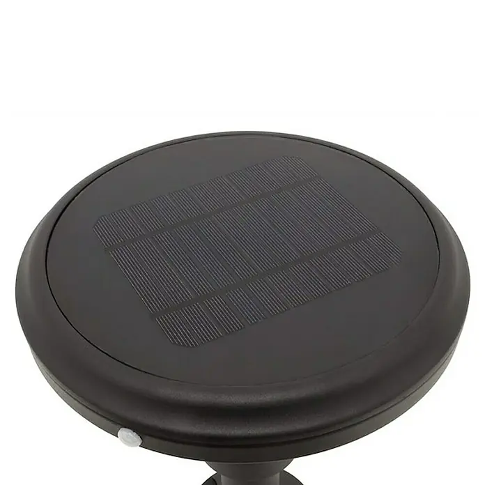 Arte confort Aplique solar para exterior Tempel - 4 W, L x An x Al: 26 x 29 x 26 cm, Negro, IP44, 500 lm - Primer plano de una luz solar negra con panel solar sobre una superficie blanca.