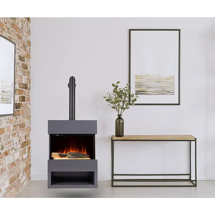 Voltomat HEATING Chimenea eléctrica Malmo - 1.500 W, Antracita, 25,1 x 55,6 x 76 cm - La imagen muestra una chimenea eléctrica gris moderna, que aporta calidez y estilo a cualquier habitación, junto a una consola con decoración.