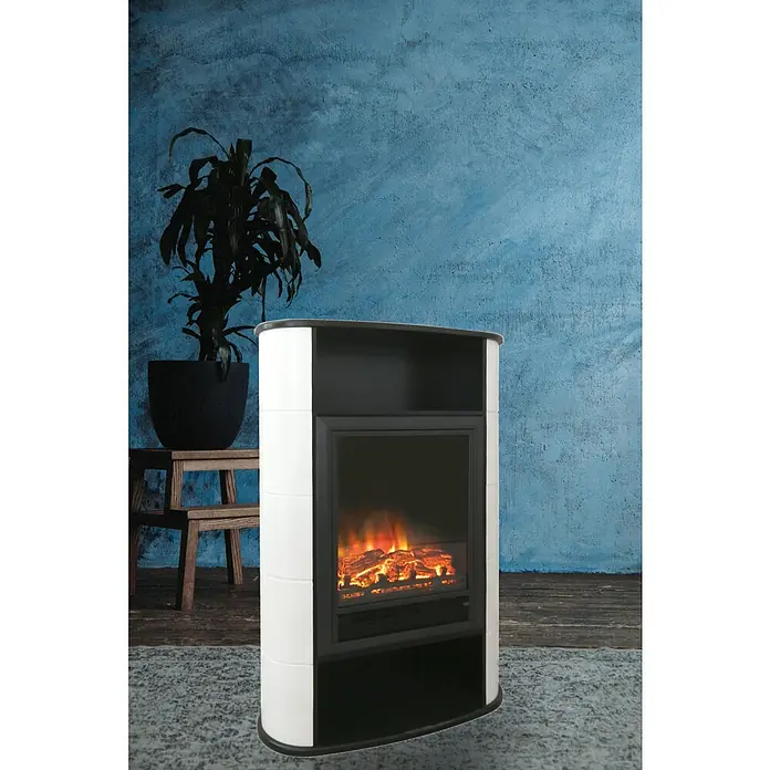 Voltomat HEATING Chimenea eléctrica Estocolmo - Blanco / Negro, 1.500 W, 30 x 73 x 110 cm - Primer plano de una chimenea eléctrica con fuego simulado, colocada en una habitación elegante con una planta y pared azul.