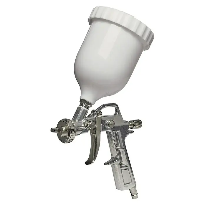 Einhell Druckluft-Farbspritzpistole mit Fließbecher - 0,6 l, 3 bar - 4 bar - Aufnahme eines detailreichen Farbspritzgeräts mit einem weißen Behälter oben, ideal für Lackierarbeiten in Werkstätten oder im Handwerk.