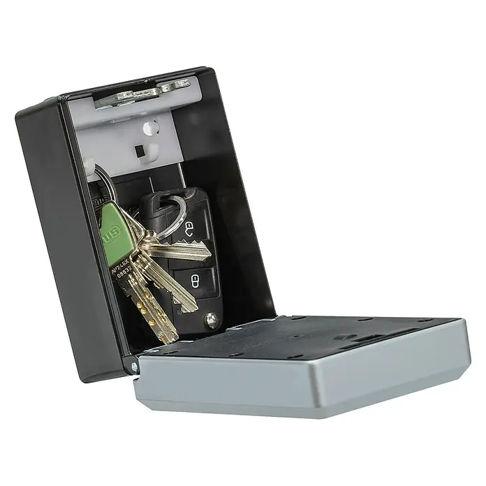 Abus Schlüsselbox Key Garage 787 Smart Bluetooth - Geeignet für: Bis zu 20 Schlüssel, L x B x H: 63 x 82,55 x 120 mm, Ohne Bügel - Ein Schlüsselkasten mit mehreren Schlüsseln darin, auf einem schwarzen Hintergrund.