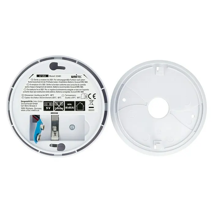 Hitzealarm85 dB - Das Bild zeigt einen runden, weißen Rauchmelder GS401 von UniTEC mit abnehmbarer Montageplatte und sichtbarem Batteriefach.