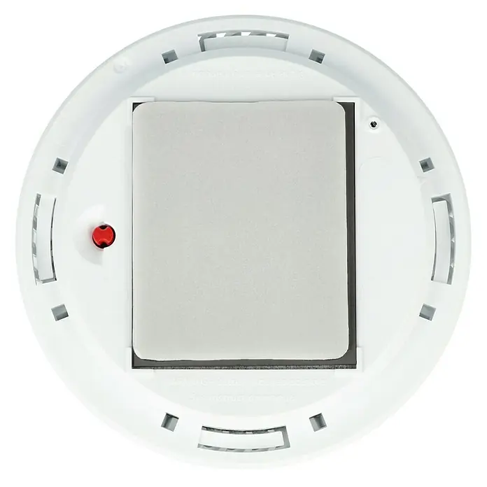 Gloria Rauchwarn- & Hitzemelder PX-1 - Durchmesser: 10,5 cm, Batterielaufzeit: 10 Jahre, Alarmsignal: 85 dB - Detailaufnahme eines runden, weißen Brandmelders mit einem zentralen, quadratischen Sensor und Montageöffnungen.