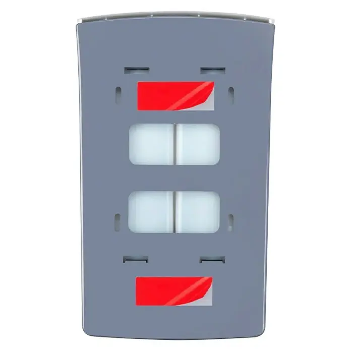 Wenko Dispensador de jabón Tartas - Plástico, Blanco, Capacidad del depósito: 960 ml - Primer plano de un detector de movimiento gris con cuatro aberturas, dos cubiertas con lámina roja, sobre un fondo negro.