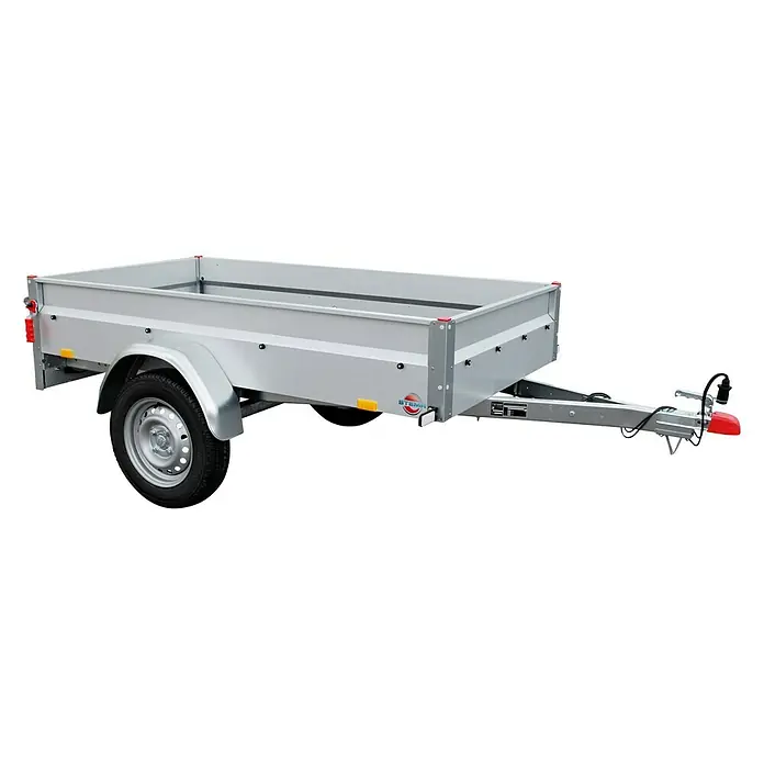 Stema Anhänger Basic 750 mit Bordwandaufsatz - Nutzlast: 601 kg, Einachser, Ungebremst - Das Bild zeigt einen PKW-Anhänger mit einer silbernen Karosserie und einem einzelnen Rad, der für den Transport von Gütern konzipiert ist.