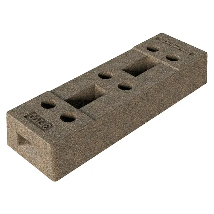 Schake Bauzaunfuß - 70 x 22 x 12,5 cm, Beton - Grauer Hartschaumstoffblock mit mehreren Aussparungen und Löchern, ideal für die Organisation von Werkzeugen oder Kleinteilen.