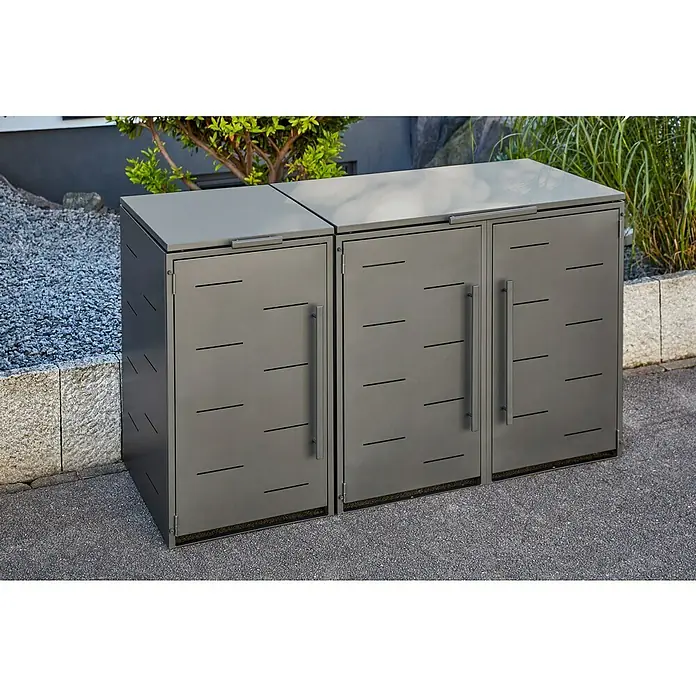 Sunfun Mülltonnenbox - B x T: 134 x 81,5 cm, Anthrazit, Stahl, Geeignet für Anzahl Mülltonnen: 2 Stk. - Drei graue Mülltonnenboxen stehen draußen mit Büschen im Hintergrund.