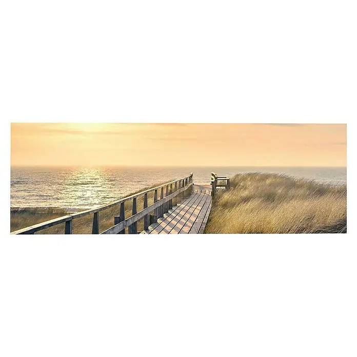 Reinders Decopanel - Way to The Sea, B x H: 156 x 52 cm - Holzsteg führt zu einem Strand. Das warme Licht der Sonne taucht die Szene in sanfte Farben, während die Wellen sanft an Land rollen.