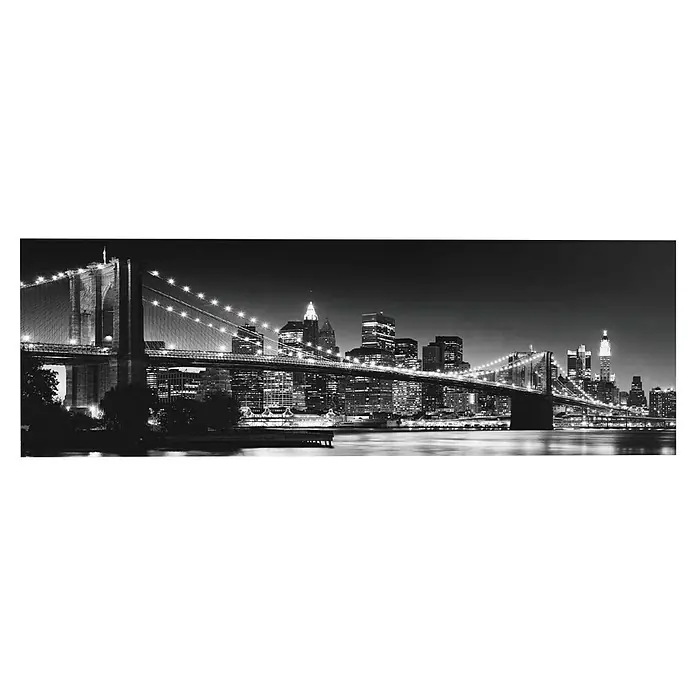 Reinders Decopanel - New York - Brooklyn Bridge, B x H: 156 x 52 cm - Schwarz-Weiß-Foto der Brooklyn Bridge bei Nacht, die New Yorker Skyline mit ihren ikonischen Wolkenkratzern beleuchtet.