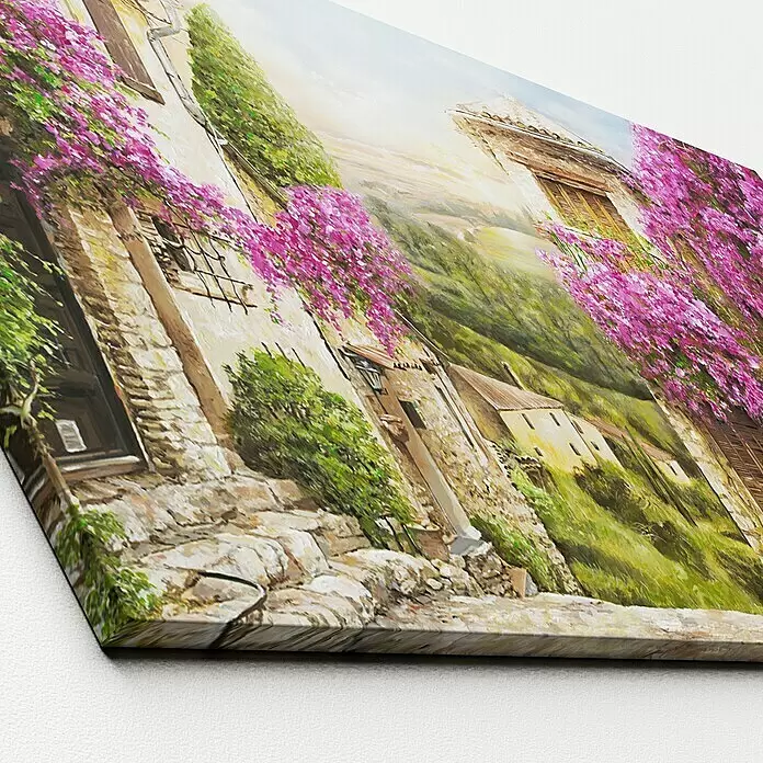 ProArt Leinwandbild - Colourful Toscana, B x H: 115 x 55 cm - Leinwanddruck einer lebhaften Dorflandschaft mit rosa Blumen, schräg gezeigt, mit dicken Kanten.