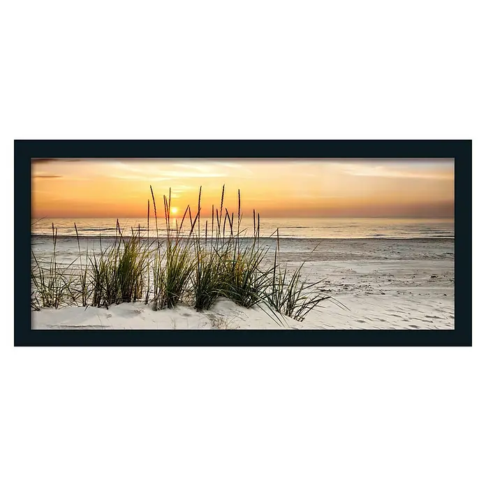 ProArt Leinwandbild Framed Art Oversized - Lonely Dune, B x H: 124 x 50 cm - Das Foto zeigt einen wunderschönen Sonnenuntergang am Strand, mit Gräsern im Vordergrund und einem friedlichen Ozean im Hintergrund.