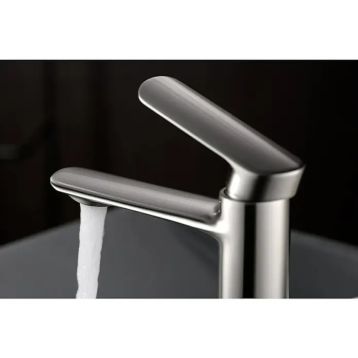 Imex Ural Grifo de lavabo - Níquel - Primer plano de un moderno grifo de acero cepillado con agua corriente.