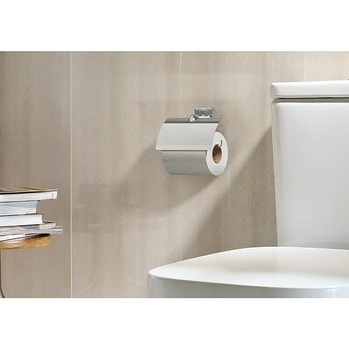 Roca Victoria Portarrollos papel higiénico - Cromo, Metal - Primer plano de un elegante portarrollos cromado con un rollo de papel higiénico casi vacío en un baño moderno.