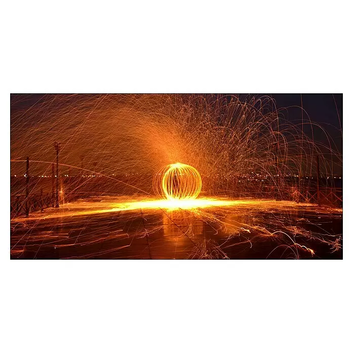 ProArt Leinwandbild - Orange Fireball, B x H: 160 x 80 cm - Leuchtende Kugel aus gesponnener Stahlwolle, die Funken in der Dunkelheit freisetzt und Lichtspuren am Boden hinterlässt.