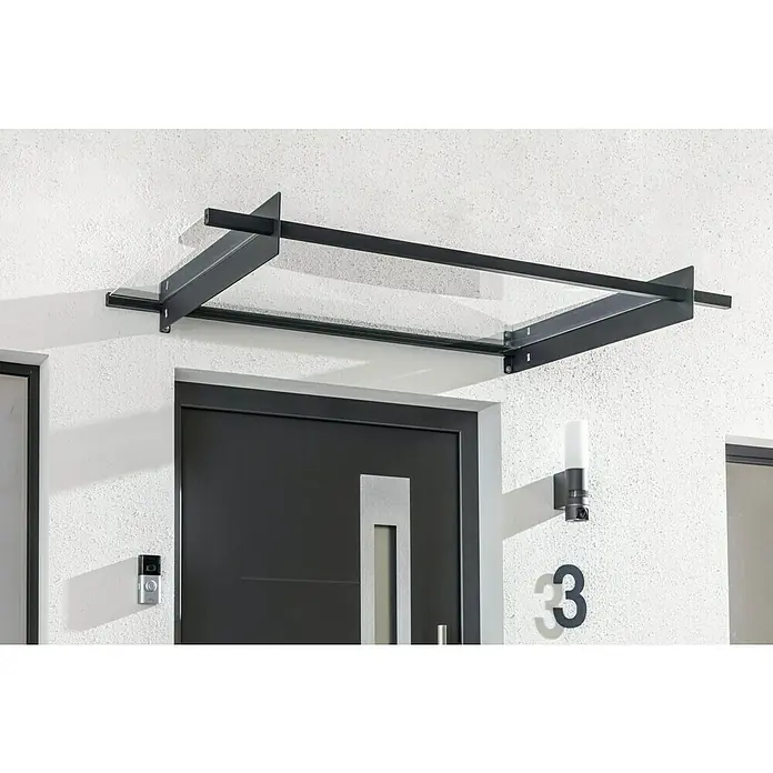 Solid Elements Marquesina para puerta Nancy - 150,5 x 94 x 14 cm, Gris antracita - Una puerta principal moderna con un elegante dosel de vidrio y marco de metal oscuro, iluminada por una lámpara de exterior elegante.