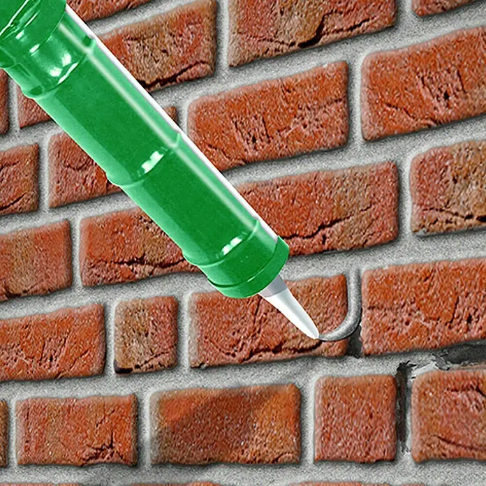 MEM Reparaturmörtel Fix&Fertig - Zementgrau, 300 ml - Das grüne Dichtmittel wird aufgetragen, um die Fugen zwischen den Ziegeln aufzufüllen und die Mauer wasserdicht zu machen.