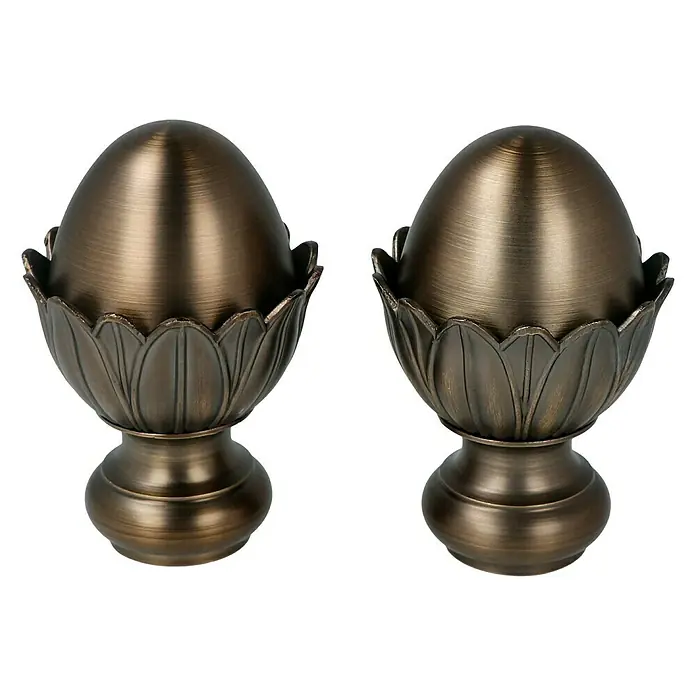 Expo Ambiente Endstück Victory - Brüniert, Geeignet für: Gardinenstangen Ø 20 mm, 2 Stk. - Detailaufnahme von zwei bronzefarbenen Vorhangstangenabschlüssen in Form einer Lotusblüte mit einem ei-förmigen Aufsatz.