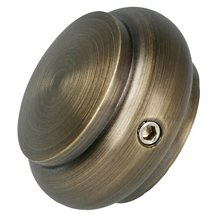 Expo Ambiente Endstück Cap-Victory - Brüniert, Geeignet für: Gardinenstangen Ø 20 mm, 2 Stk. - Nahaufnahme eines antiken Messing-Möbelknopfs mit einer Inbusschraube an der Seite.