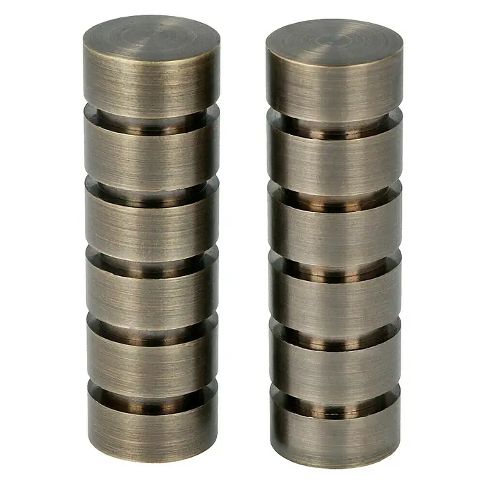 Expo Ambiente Endstück Rillcube - Brüniert, Geeignet für: Gardinenstangen Ø 20 mm, 2 Stk. - Nahaufnahme von zwei bronzefarbenen Vorhang-Endstücken aus Metall mit geriffelten Designs, perfekt um jedem Raum einen Hauch von Eleganz zu verleihen.