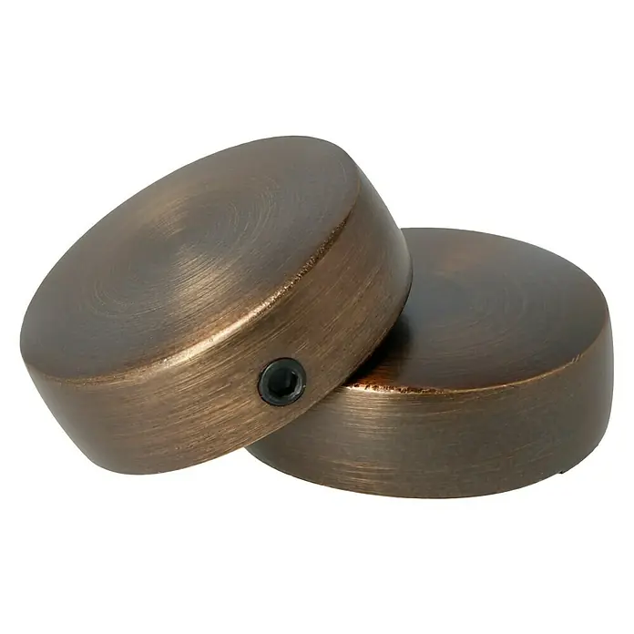 Expo Ambiente Endstück Cap - Bronze, Geeignet für: Gardinenstangen Ø 25 mm, 2 Stk. - Nahaufnahme von zwei bronzefarbenen Gitarrenknöpfen mit Madenschrauben, die auf einer schwarzen Oberfläche liegen.