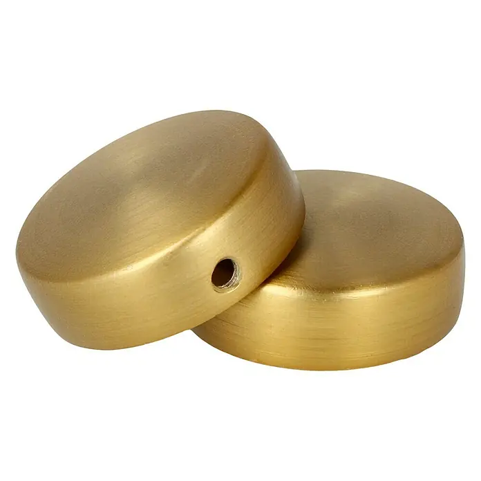Expo Ambiente Endstück Cap - Messingoptik matt, Geeignet für: Gardinenstangen Ø 25 mm, 2 Stk. - Nahaufnahme von zwei goldenen, kuppelförmigen Abdeckkappen mit einem Loch. Ideal für stilvolle Möbel und Dekoration.