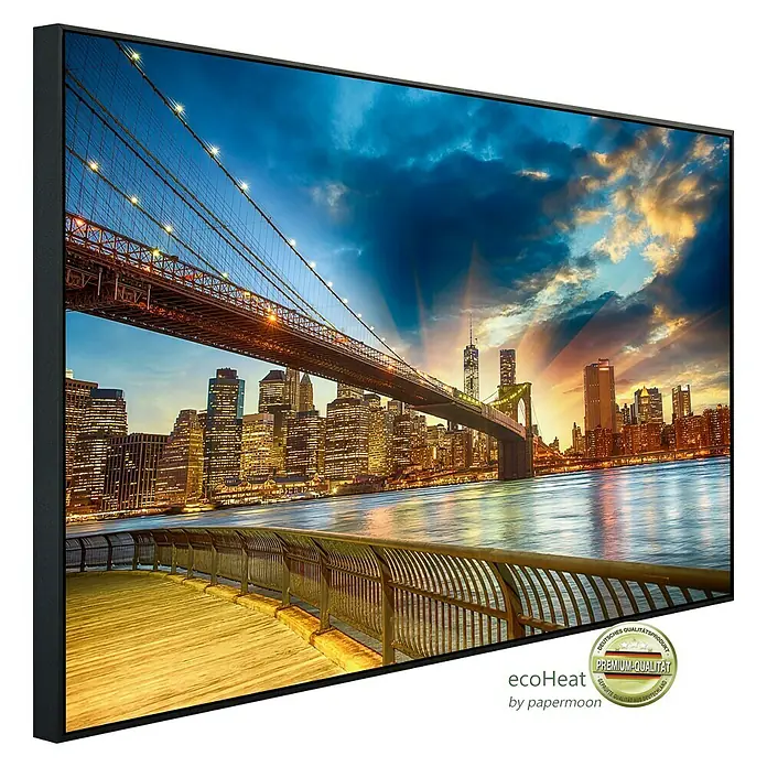 Papermoon Infrarot-Bildheizkörper Manhattan Sonnenuntergang - 120 cm x 600 mm, 1.000 W - Wandbild mit New York Skyline bei Sonnenuntergang und Brücke im Vordergrund, gerahmt und hochwertig.