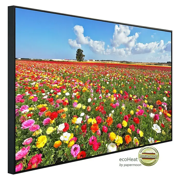 Papermoon Infrarot-Bildheizkörper Garten Butterblumen - 120 x 60 cm, 1.000 W - Gerahmtes Bild mit üppigem Blumenfeld unter blauem Himmel mit einigen Wolken.