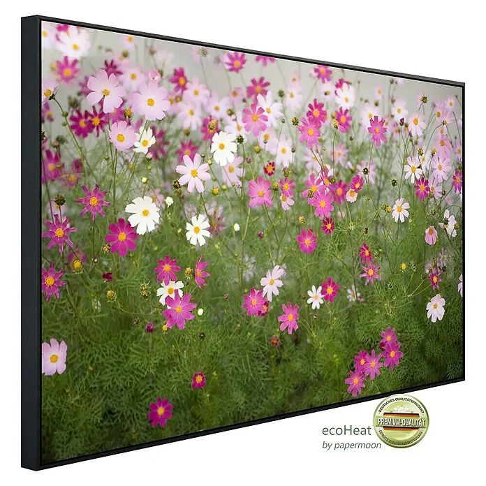 Papermoon Infrarot-Bildheizkörper Kosmosblumen - 60 x 50 cm, 350 W - Leinwandbild mit einem bunten Blumenfeld in Rosa, Weiß und Grün im schwarzen Rahmen.