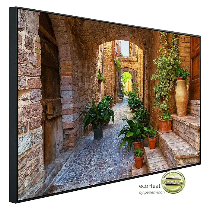 Papermoon Infrarot-Bildheizkörper Antike Stadt Spello Umbrien - 120 x 60 cm, 1.000 W - Das gerahmte Wandbild zeigt eine malerische Gasse in Italien, dekoriert mit Pflanzen. Premium-Qualität für Ihr Zuhause oder Büro, ein echter Hingucker.