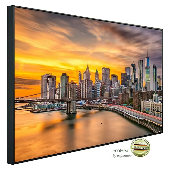 Papermoon Infrarot-Bildheizkörper Manhattan Skyline Sonnenuntergang - 120 x 60 cm, 1.200 W - Wandbild mit New York Skyline im Sonnenuntergang. Hochwertiger Kunstdruck im schwarzen Rahmen für stilvolle Raumgestaltung.