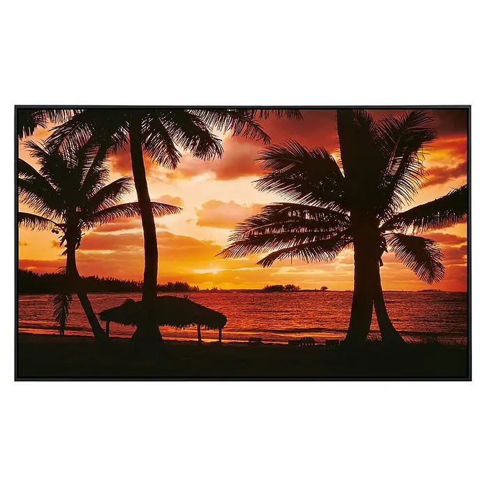 Papermoon Infrarot-Bildheizkörper Palm Beach in der Abenddämmerung - 120 x 60 cm, 1.200 W - Dieses Wandbild fängt einen ruhigen tropischen Sonnenuntergang ein, mit Palmen und sanften Wellen, gerahmt in einem schlanken, modernen Rahmen.