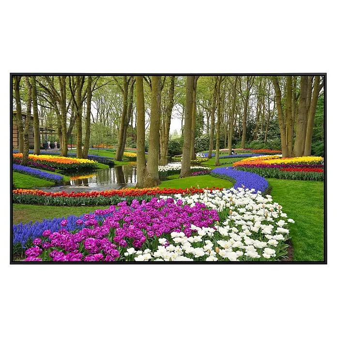 Papermoon Infrarot-Bildheizkörper Tulpen im Keukenhof-Park - 100 cm x 600 mm, 600 W - Farbenfrohe Blumenfelder und Bäume säumen einen kleinen Fluss in einem malerischen Garten.