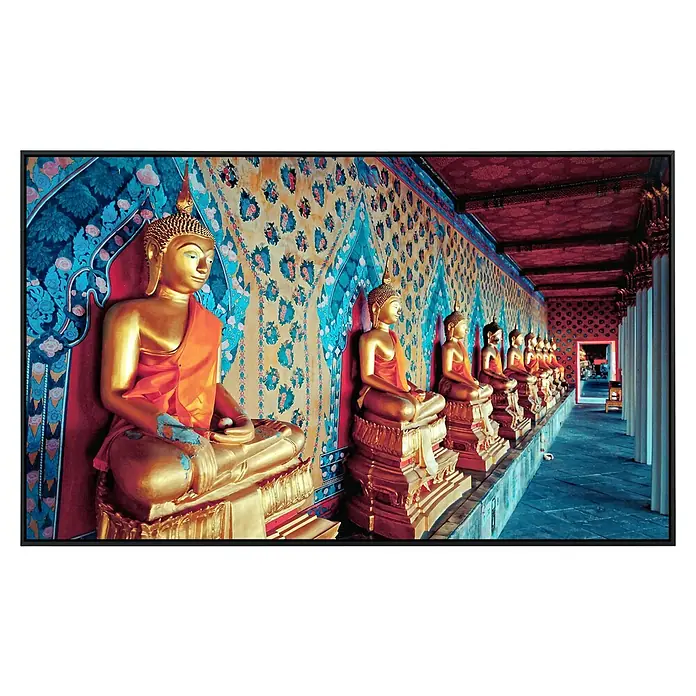 Papermoon Infrarot-Bildheizkörper Goldene Statuen Buddhas - 1.200 x 600 mm, 1.200 W - Eine Reihe goldener Buddha-Statuen, jede in traditioneller Robe, die in einem wunderschön verzierten Tempel sitzt, erzeugt eine spirituelle Atmosphäre.