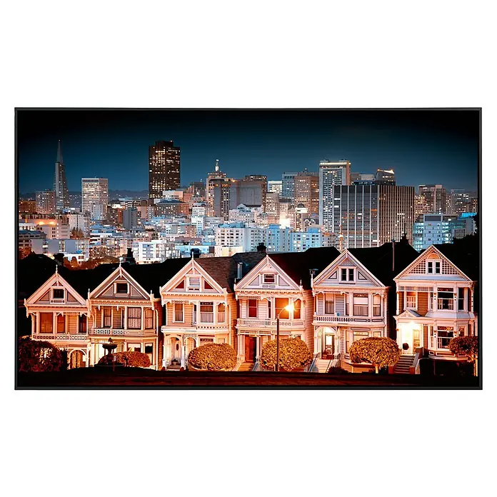 Papermoon Infrarot-Bildheizkörper Stadtlandschaft in San Francisco - 1.000 x 600 mm, 600 W - San Francisco Painted Ladies Häuser mit beleuchteter Stadtkulisse im Hintergrund, ein stimmungsvolles Wandbild.
