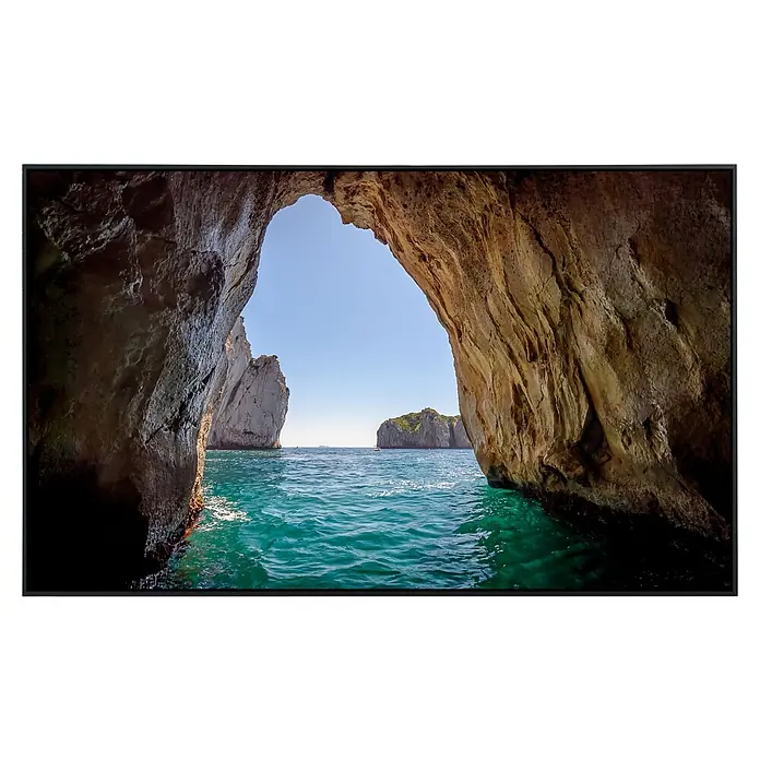 Papermoon Infrarot-Bildheizkörper Blaue Grotte in der Insel Capri - 100 x 60 cm, 800 W - Ein beeindruckendes Landschaftsbild auf einem modernen Flachbildfernseher, das ein Felsenbogen-Motiv mit kristallklarem Wasser zeigt.