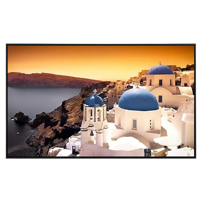 Papermoon Infrarot-Bildheizkörper Santorini Sonnenuntergang 1 - 120 cm x 600 mm, 1.200 W - Ein atemberaubendes Foto, eingefasst in einem eleganten Rahmen, zeigt die malerische Landschaft von Santorin mit ihren ikonischen blau-weißen Gebäuden.
